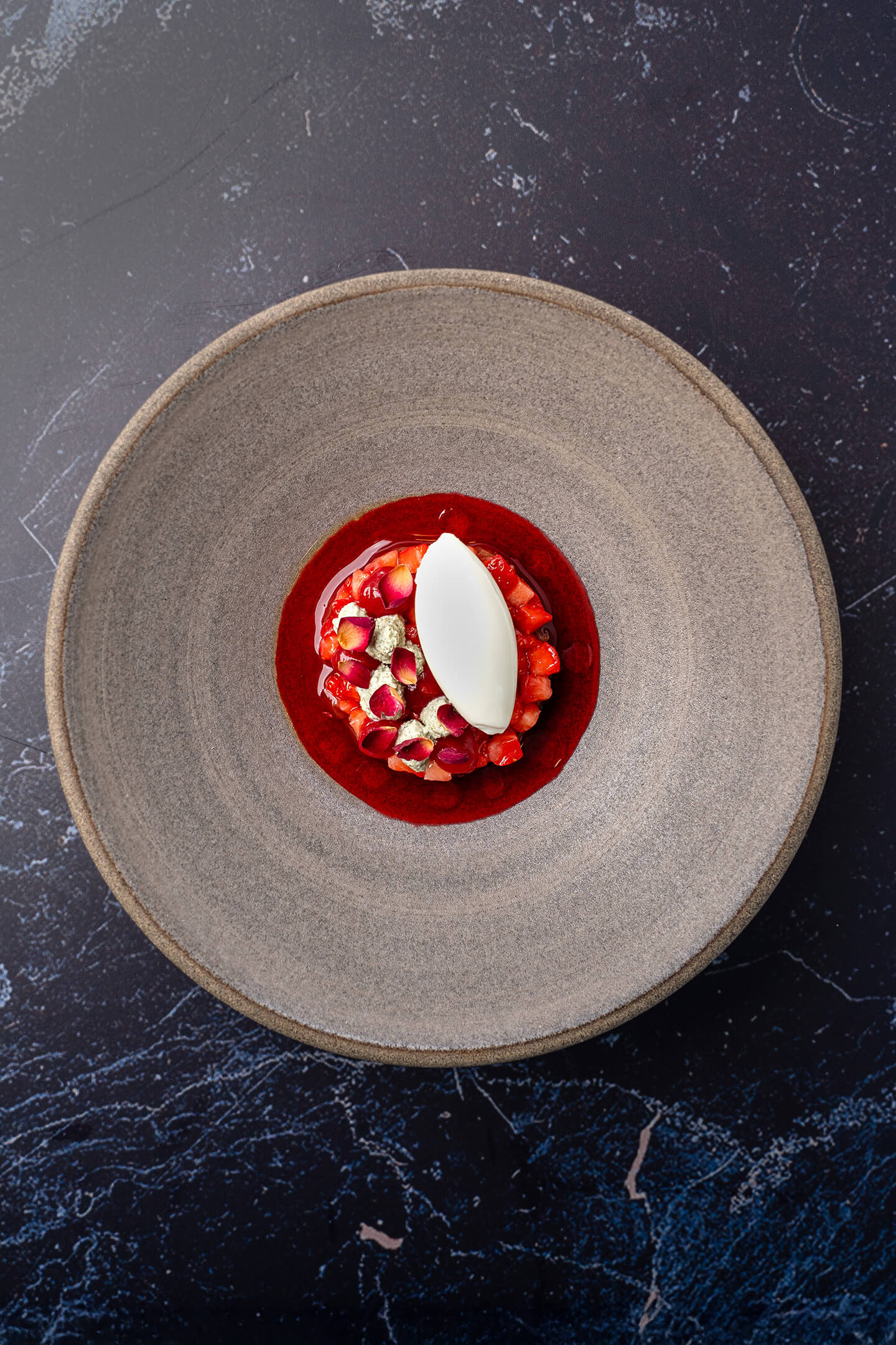 Rhubarb compote with meadowsweet and pumpkin seed ice cream